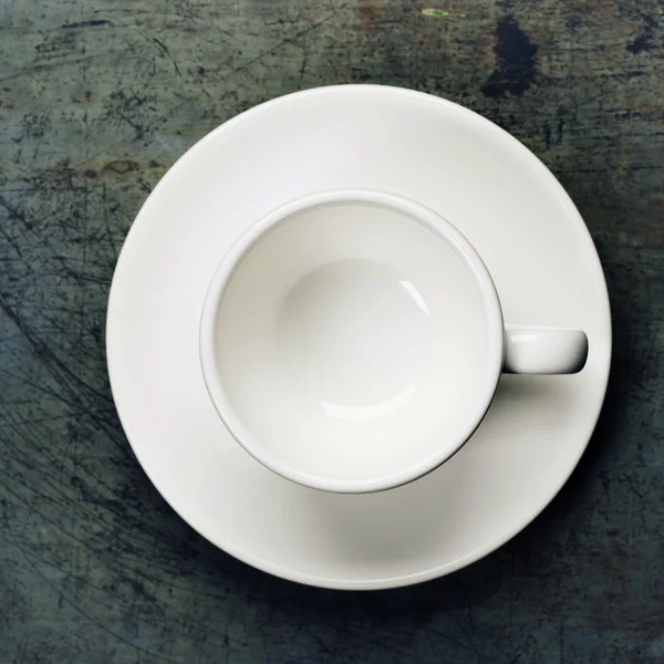 Taza de café espresso vacía en un platillo — Foto de Stock