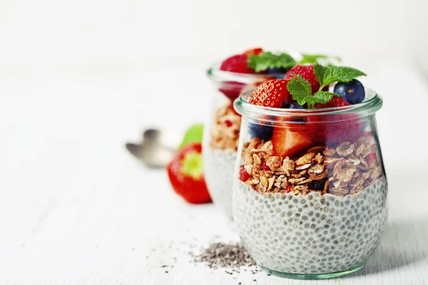 Chia seeds vanilla pudding and berries on wooden rustic backgr — Stock Photo, Image