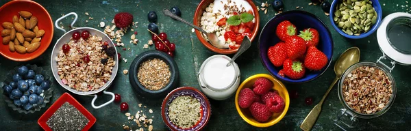 Healthy breakfast of muesli, berries with yogurt and seeds — Stock Photo, Image