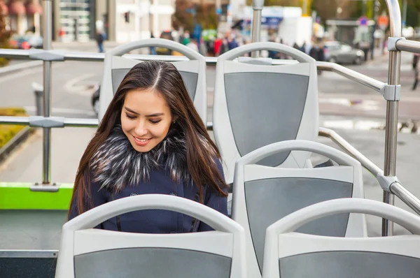 Portrait of attractive young woman with long beautiful hairs in open tour bus,  Luxembourg city. — Stock Photo, Image