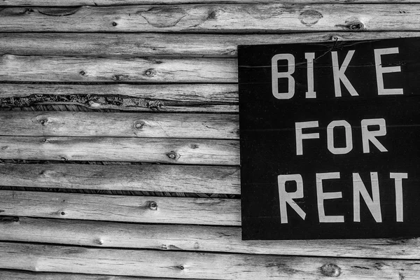 "Bike for rent" - wooden background with copy space. — Stock Photo, Image