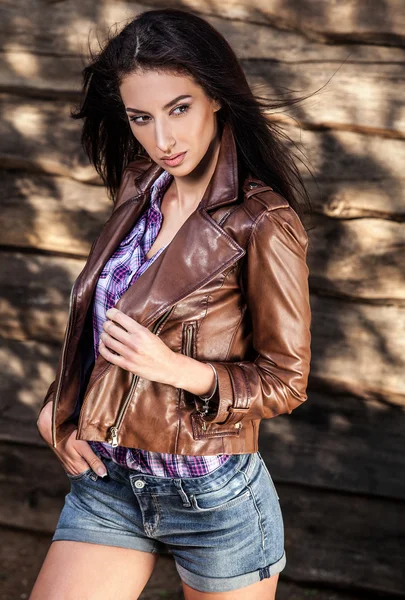 Young sensual & beauty brunette woman pose on grunge wooden background — Stock Photo, Image