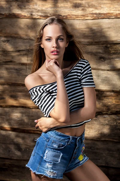 Young sensual & beauty blonde woman pose on grunge wooden background — Stock Photo, Image