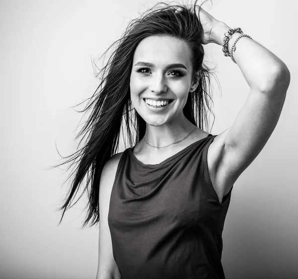 Studio portrait of beautiful young brunette woman — Stock Photo, Image