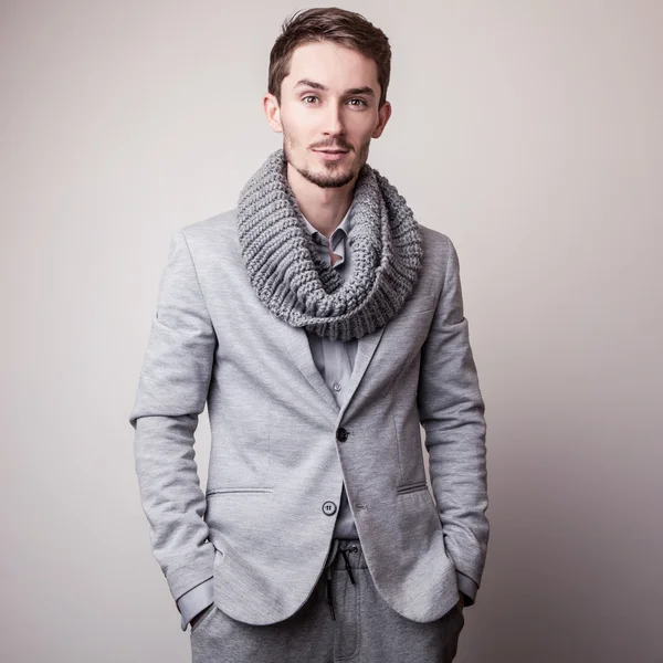 Elegant young handsome man in grey costume. Studio fashion portrait. — Stock Photo, Image