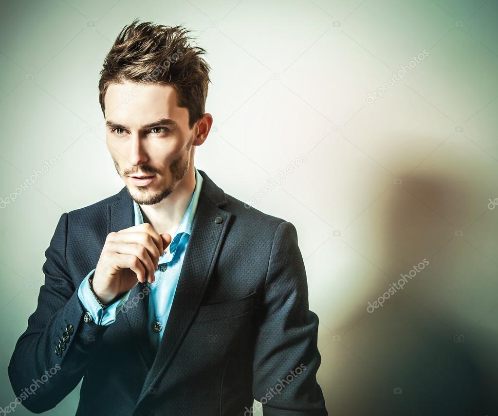 Elegant young handsome man in costume. Studio fashion portrait.