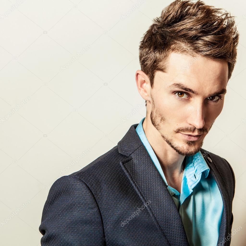 Elegant young handsome man in costume. Studio fashion portrait.