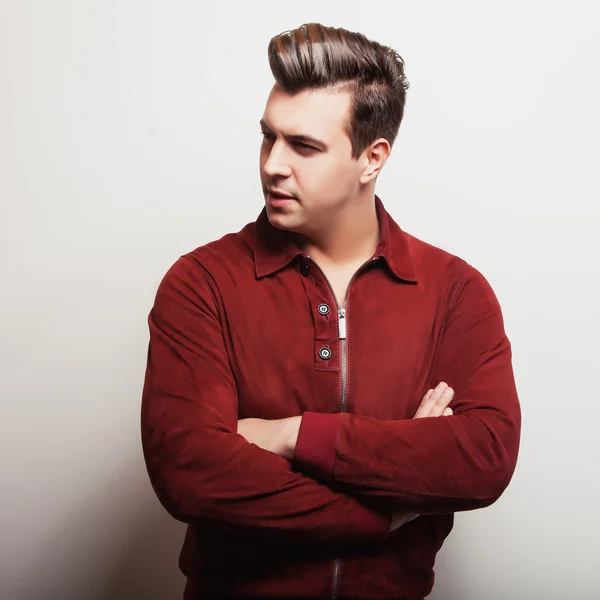 Elegant young handsome man in claret suede jacket. Studio fashion portrait. — Stock Photo, Image