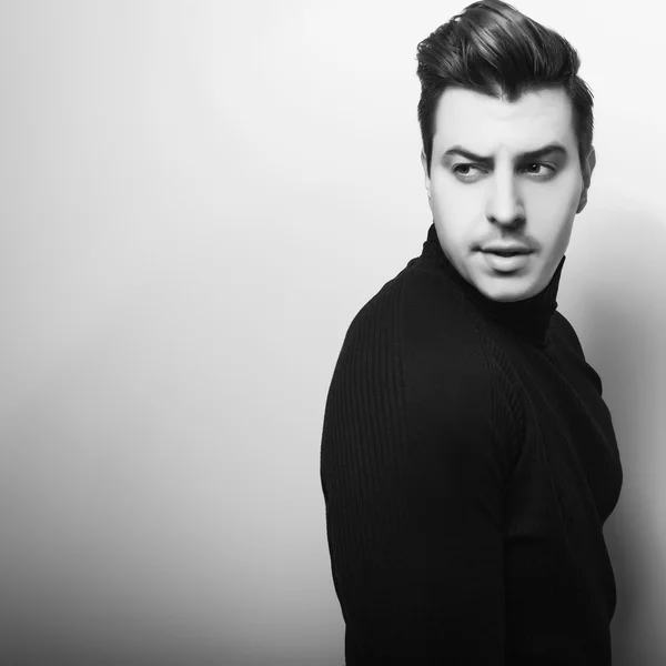 Studio portrait of young emotional handsome man. Black-white close-up photo. — Stock Photo, Image