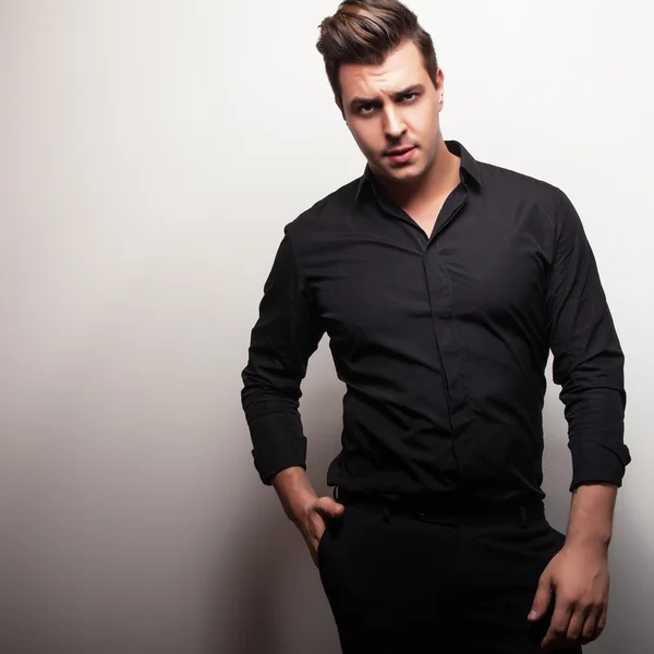 Studio portrait of young handsome man in black shirt. Close-up photo. — Stock Photo, Image