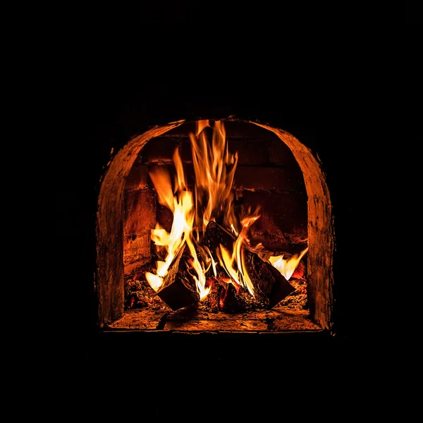 Fireplace with a blazing fire. Photo. — Stock Photo, Image