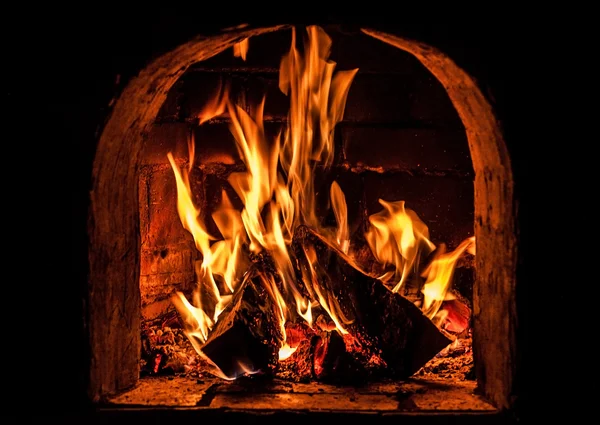 Fireplace with a blazing fire. Photo. — Stock Photo, Image