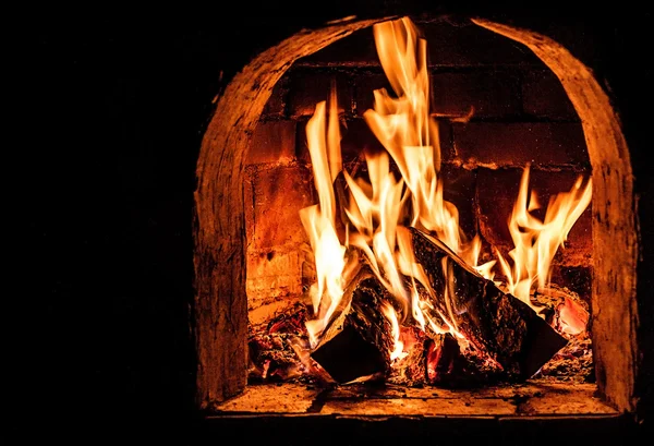 Fireplace with a blazing fire. Photo. — Stock Photo, Image