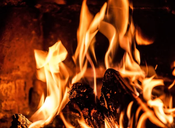 Fireplace with a blazing fire. Photo. — Stock Photo, Image