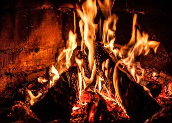 Fireplace with a blazing fire. Photo. — Stock Photo, Image