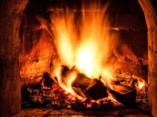 Fireplace with a blazing fire. Photo. — Stock Photo, Image