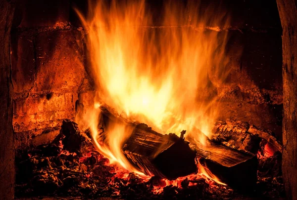 Fireplace with a blazing fire. Photo. — Stock Photo, Image