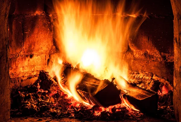 Fireplace with a blazing fire. Photo. — Stock Photo, Image