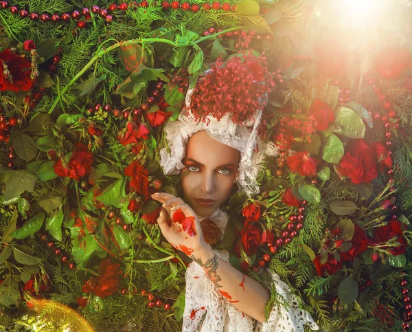 Fairy tale woman portrait surrounded with natural plants and roses. Art image in bright fantasy stylization. — Stockfoto