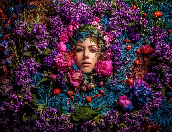 Fairy tale girl portrait surrounded with natural plants and flowers. Art image in bright fantasy stylization. — Stock Photo, Image