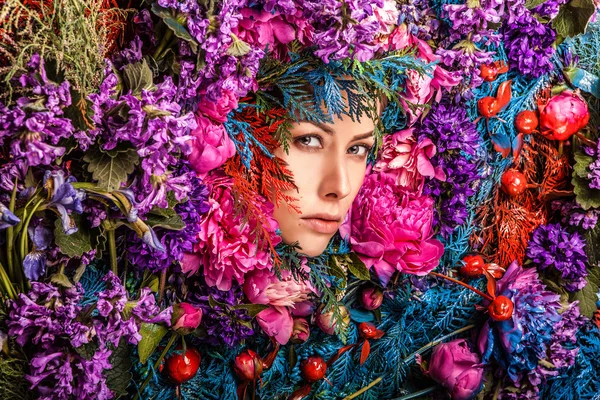 Fairy tale girl portrait surrounded with natural plants and flowers. Art image in bright fantasy stylization. — Stock Photo, Image