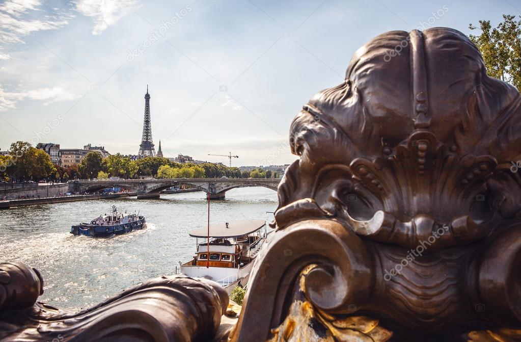 Eiffel Tower with boats on Seine