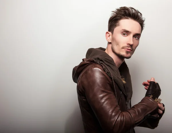 Attractive young man in leather jacket — Stock Photo, Image