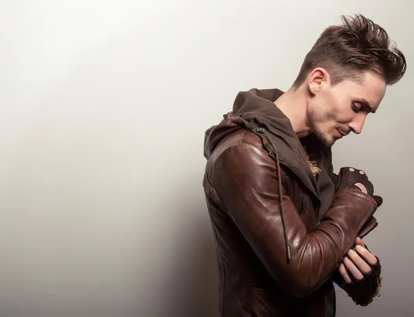 Attractive young man in leather jacket — Stock Photo, Image