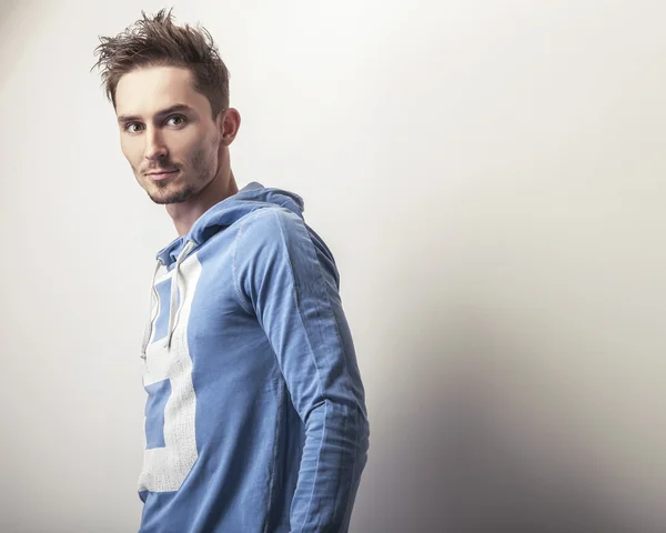 Young man in blue sports sweater — Stock Photo, Image