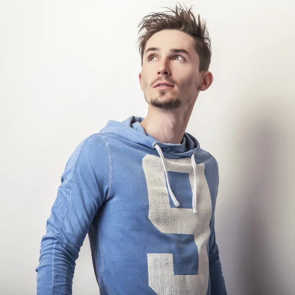 Young man in blue sports sweater — Stock Photo, Image