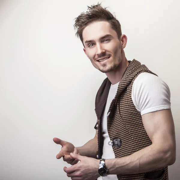 Attractive young man in brown sweater — Stock Photo, Image