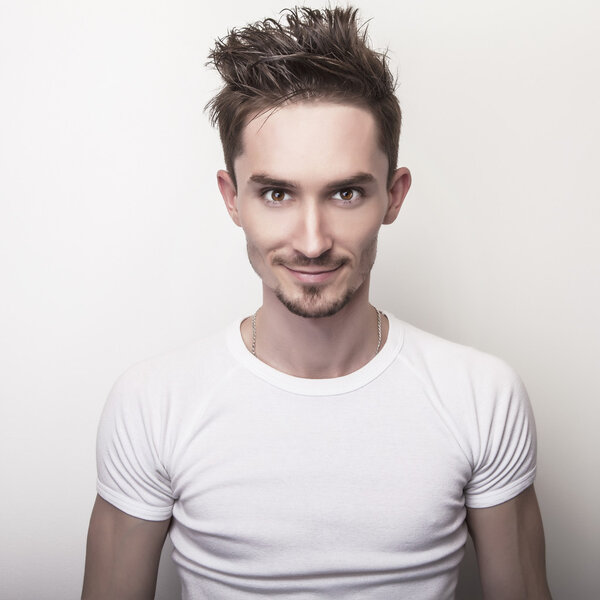 Young handsome man in casual t-shirt.