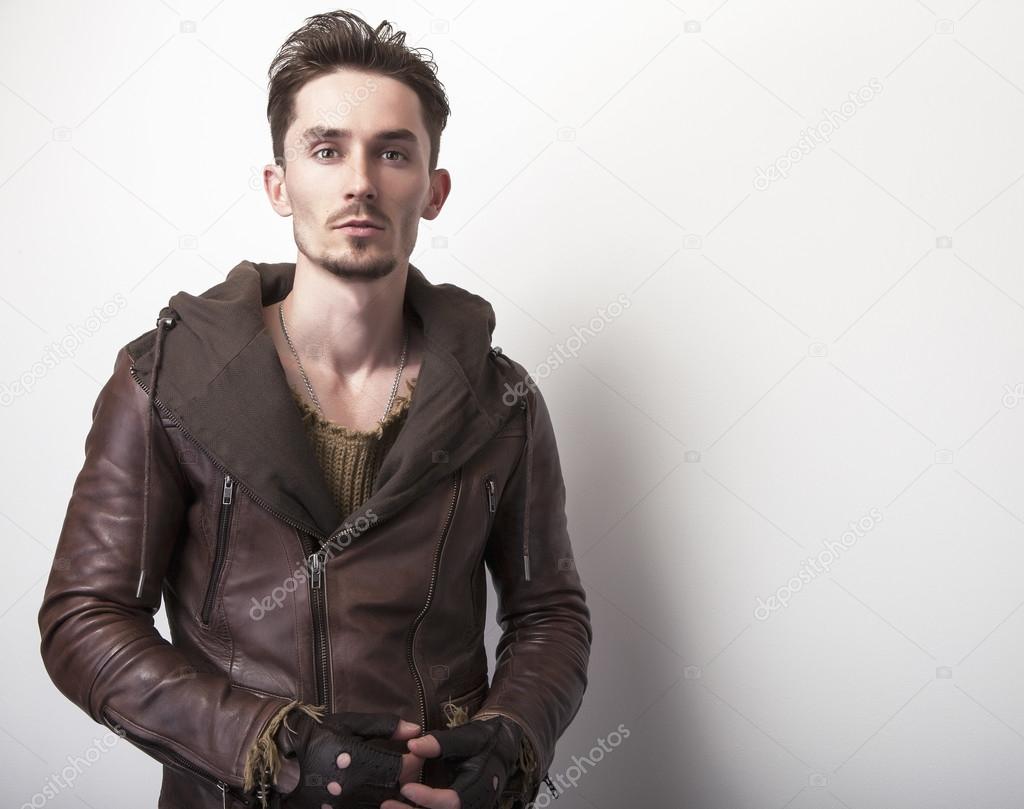 young man in brown leather jacket