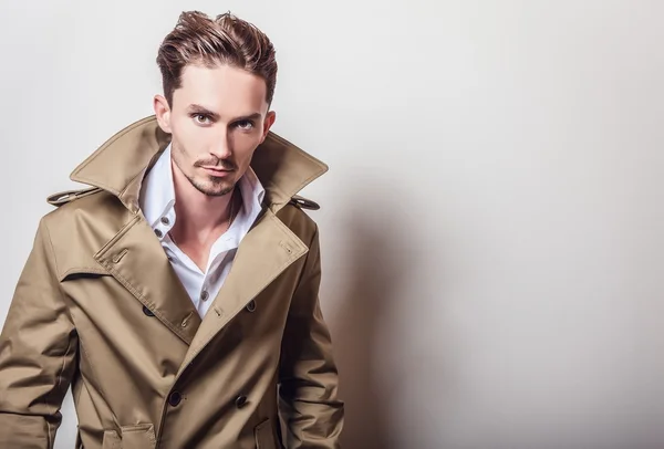 Elegant man in long stylish coat — Stock Photo, Image