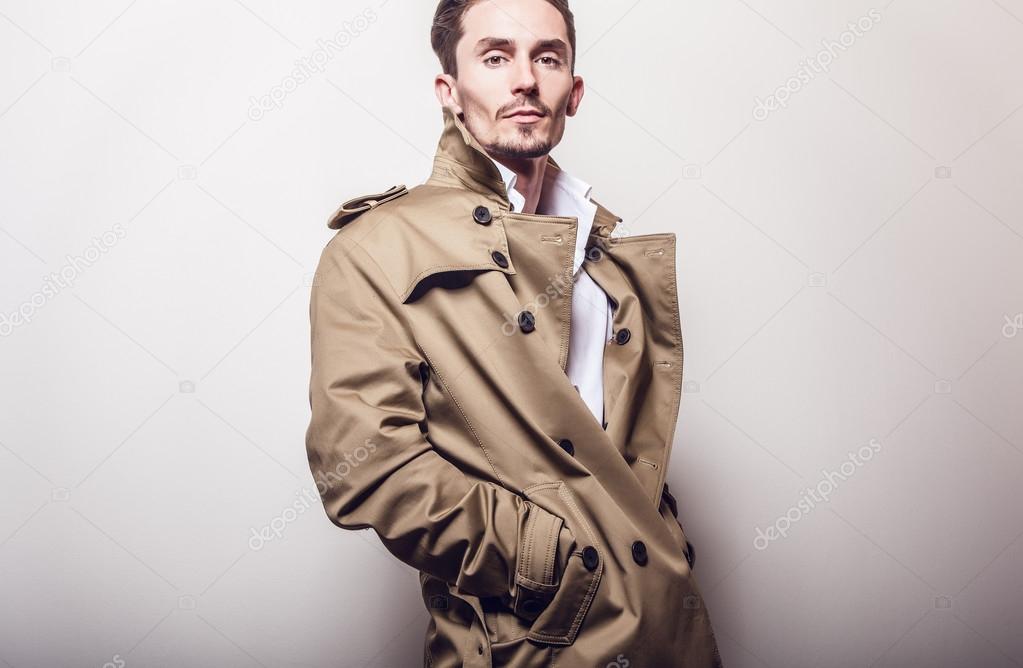 Elegant man in long stylish coat