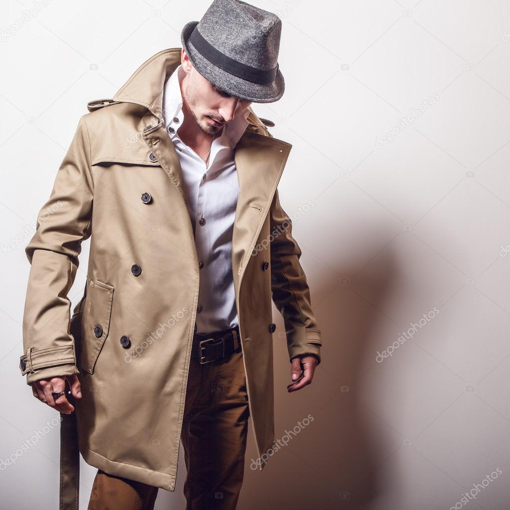 man in long stylish coat and hat