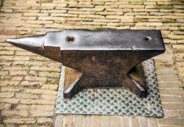 Medieval anvil of smith in Muiderslot castle clipart