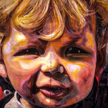 ROTTERDAM, NETHERLANDS - DECEMBER 26, 2015: Children portrait on wall of city building close-up on December 26, 2015 in Rotterdam - Netherlands.