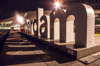 AMSTERDAM, NETHERLANDS - JANUARY 20, 2016: City sights of Amsterdam at night. General views of city landscape on January 20, 2016 in Amsterdam - Netherland.