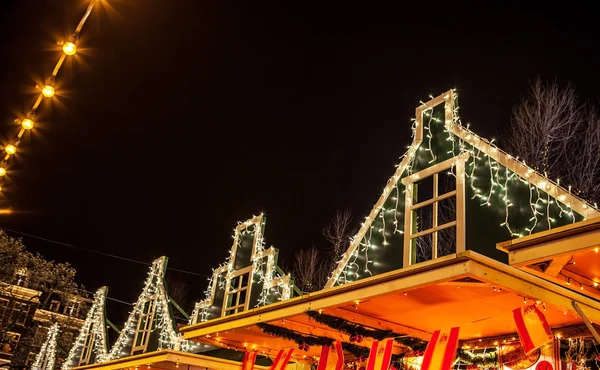 Decorative Christmas decorations on streets of night Amsterdam. — Stock Fotó