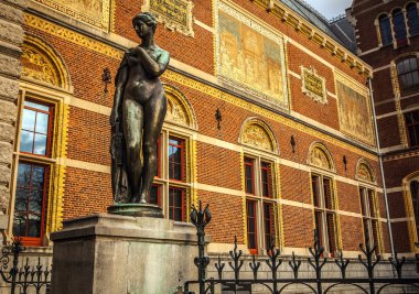 AMSTERDAM, NETHERLANDS - JANUARY 1, 2016: Ancient bronze statue in park of The Rijksmuseum (Netherlands national museum dedicated to arts and history in Amsterdam).  Amsterdam - Netherland.