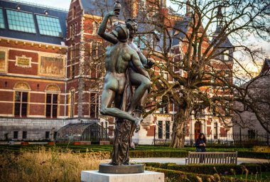 AMSTERDAM, NETHERLANDS - JANUARY 1, 2016: Ancient bronze statue in park of The Rijksmuseum (Netherlands national museum dedicated to arts and history in Amsterdam).  Amsterdam - Netherland.