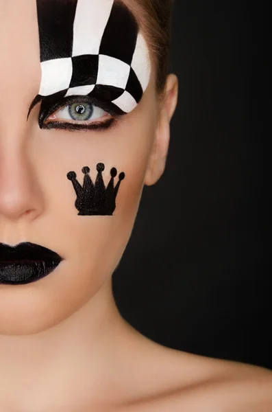 Woman with black and white face art — Stock Photo, Image