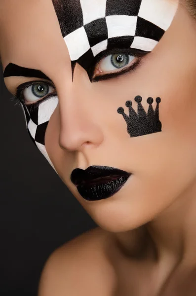 Beautiful woman with black and white face art — Stock Photo, Image