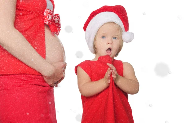 Surprise femme enceinte et enfant à Noël, flocons de neige — Photo