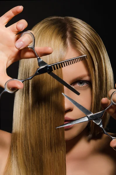 Young woman with straight hair and scissors — Stock Photo, Image