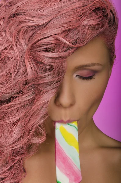 Sexy woman with pink hair and candy — Stock Photo, Image