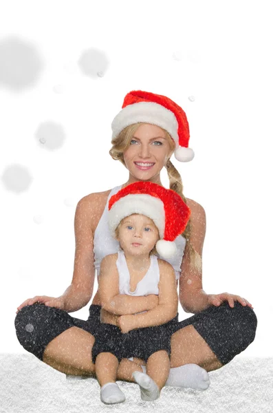 Familie kleding voor fitness en Santa hoeden — Stockfoto