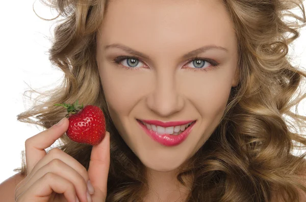 Young woman with strawberry in hands — Stock Photo, Image