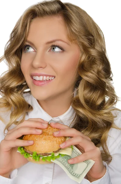 Mujer joven con hamburguesa de dólares mirando hacia otro lado — Foto de Stock